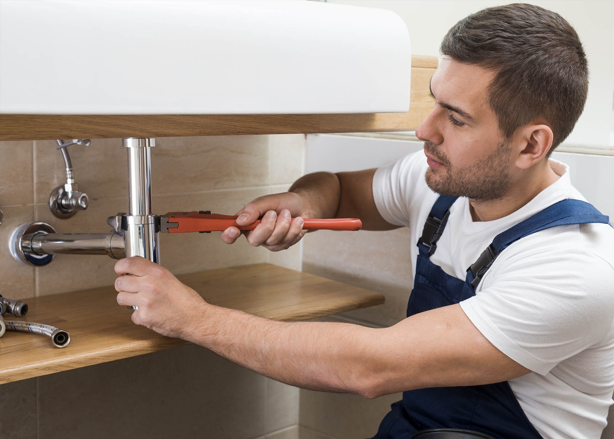 H-VAC and plumbing service professionals at work
